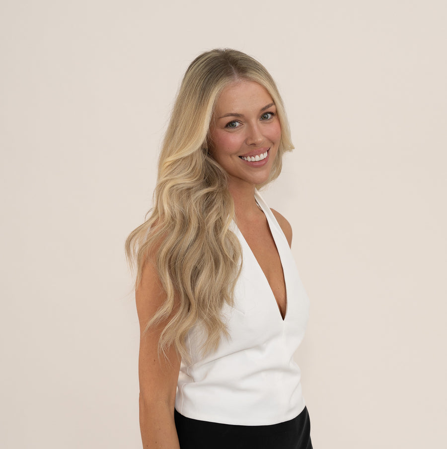 Smiling model with long blonde wavy hair
